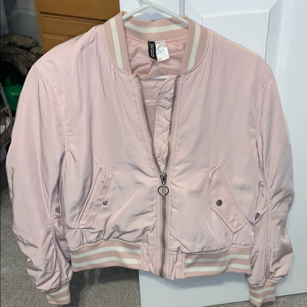 Pale pink varsity styled jacket.